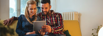 couple looking at something on a tablet